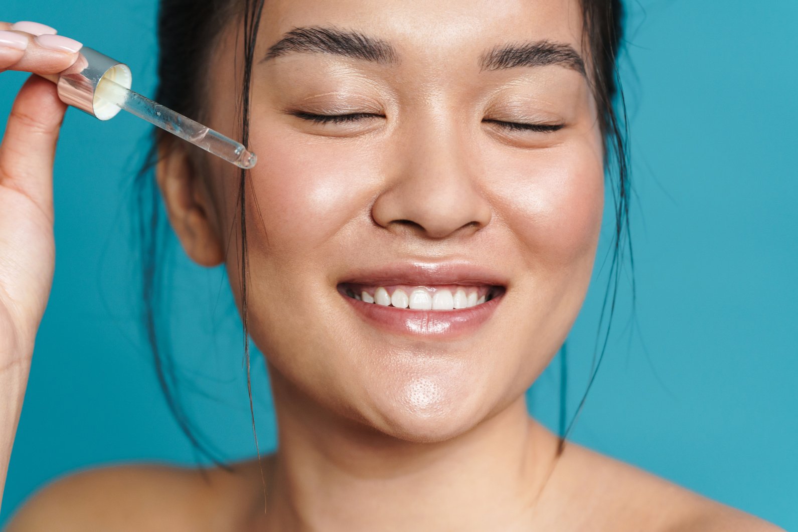 Beauty Portrait of a Smiling  Young Asian Woman